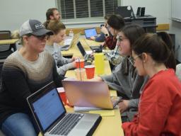 Communication Studies Department Chair, Dr. Jody Koenig Kellas and faculty member Dr. Justin Kirk work with Communication Studies students at a Department Advisory Board hosted study night.