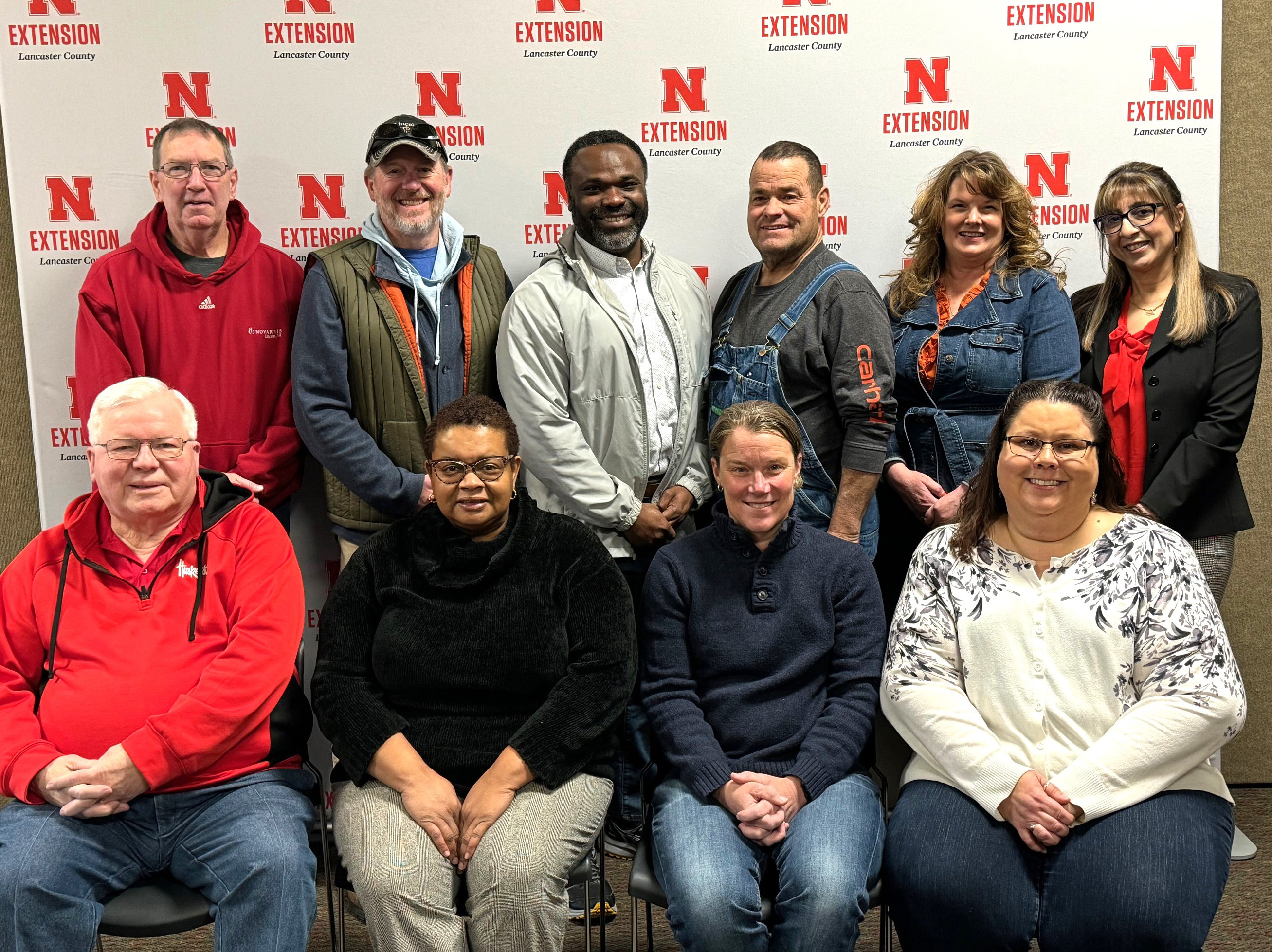 2024 Lancaster County Extension Board members: (front row L–R) Gerald Clausen, Regina Sullivan, Meghan Sittler, Nicole Miller; (back row L–R) Phil Wharton, Jim Ballard, Phil Bruce, Bob Huttes, Teresa Erdkamp, Zainab Rida.