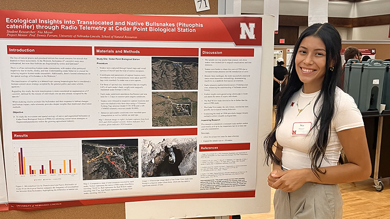 Nia Meyer presents her UCARE research on bullsnakes at the Nebraska Summer Research Program Symposium on August 6, 2024.