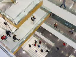 Students move through the hallways and stairwell within the College of Engineering's Kiewit Hall. Facility updates, like the addition of Kiewit Hall, are among the reasons the university improved its U.S. News and World Report ranking.