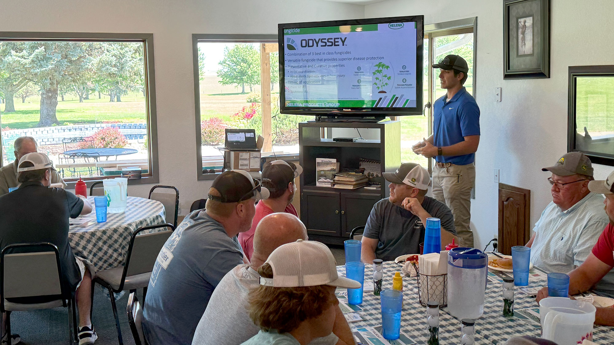 Zach Nienhueser, a University of Nebraska–Lincoln agronomy major and summer intern for Helena Agri-Enterprises out of Norkfolk, speaks to producers at a grower meeting.