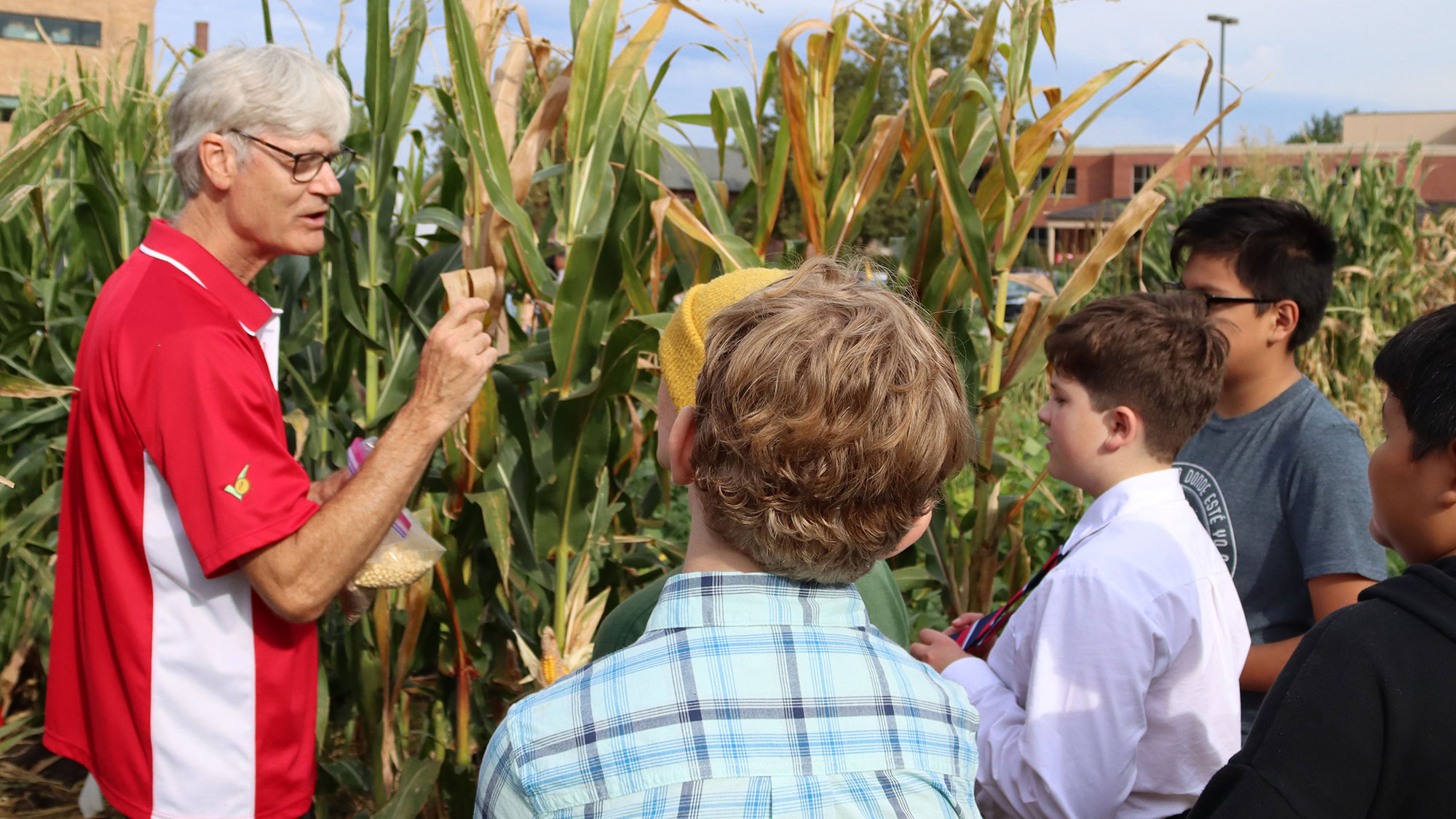 Professor Don Lee speaks to Lefler students in the Teaching Garden on East Campus.