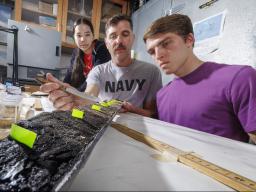 Doctoral student Jim Benes and UCARE students Jasmine Pham and Joe Stalder with charcoal samples from the Nebraska Sandhills.