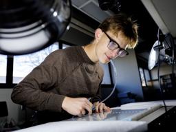 Andrew Moyer, sophomore biological sciences major, attends to his research. Photo by Jordan Opp.