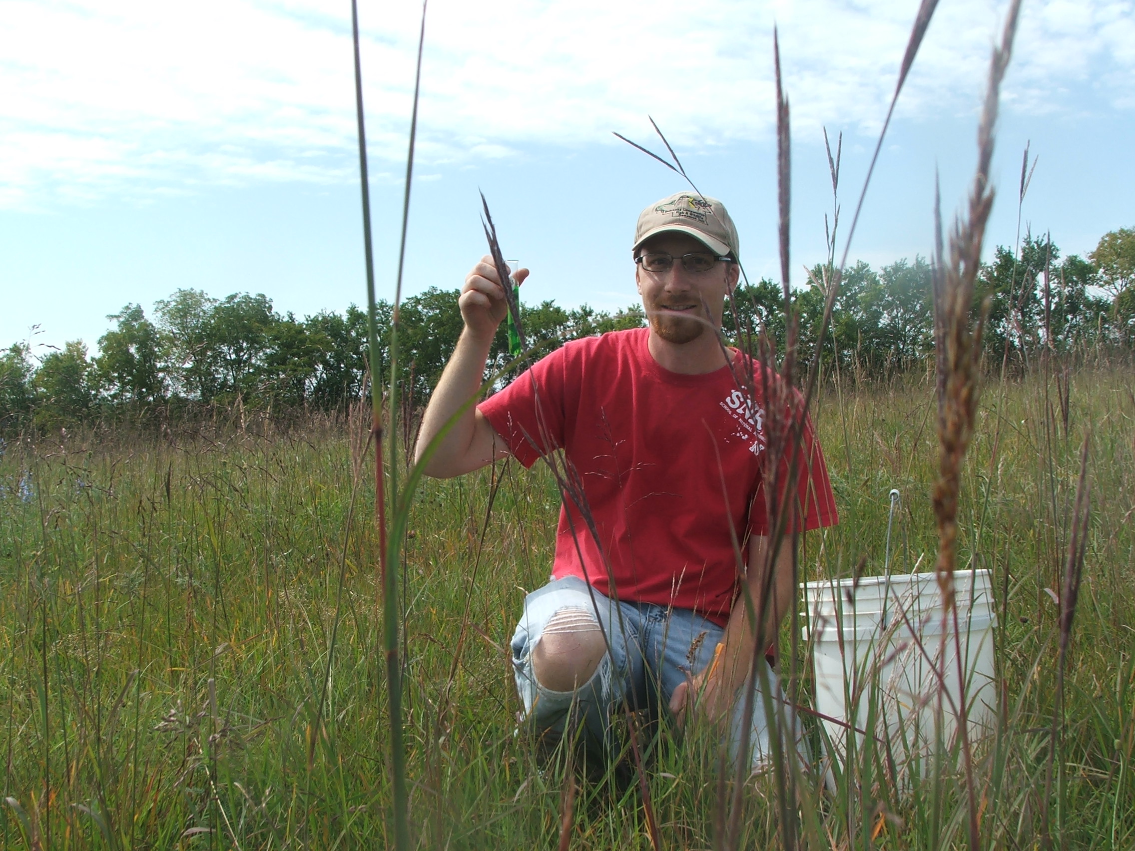 Kody Unstad holds a test tube of antifreeze, which he used as a pitfall trap to sample for insects. 