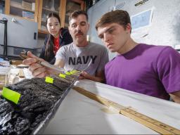 Doctoral student Jim Benes and UCARE students Jasmine Pham and Joe Stalder with charcoal samples from the Nebraska Sandhills.