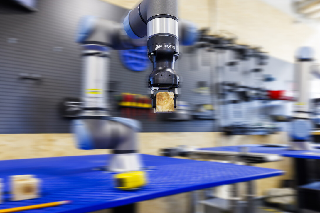 A robotic arm is programmed to stack blocks at Nebraska Innovation Studio. The Universal Robot CORE Training is now offered as a digital badge course.