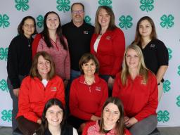 (Front row L-R) Madelaine Polk, Elizabeth Thiltges; (Middle row L-R) Tracy Anderson, Kristin Geisert, Kate Pulec; (Back row L-R) Vicki Jedlicka, Haley Hogue, Jim Wies, Jenny DeBuhr, Caroline White