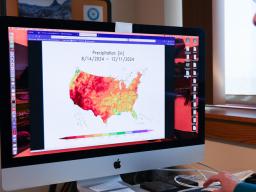 William Sorensen, senior applications/systems programmer for the High Plains Regional Climate Center, reviews an Applied Climate Information System map. Photo by Russell Shaffer | IANR Media 