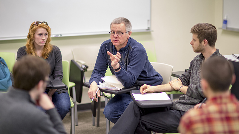 David Gosselin (at center) in discussion with students in class. 