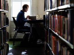 Camden Hjermstad, a freshman mechanical engineering major, studies in Love Library South on Dec. 2. Hjermstad was among 7,300-plus Husker students named to the fall 2024 Deans’ List.