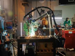 Behind the scenes photo of the Nebraska Innovation Studios welding robot on June 25, 2024. Photo by Kristen Labadie / University Communication.