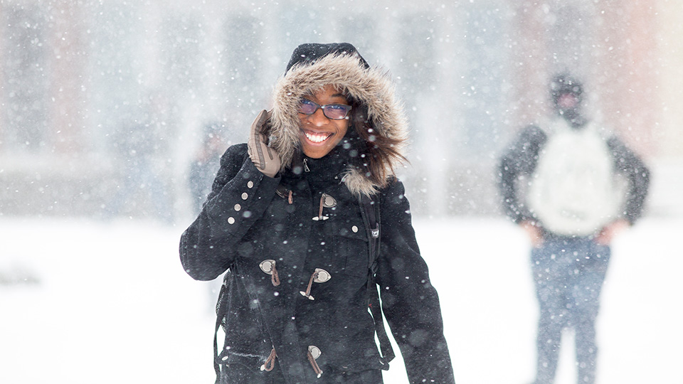 UNL students walk through a snowfall on campus. [Craig Chandler | University Communications and Marketing]