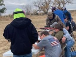 Teaching the basics of firearm safety in smallbore rifle.