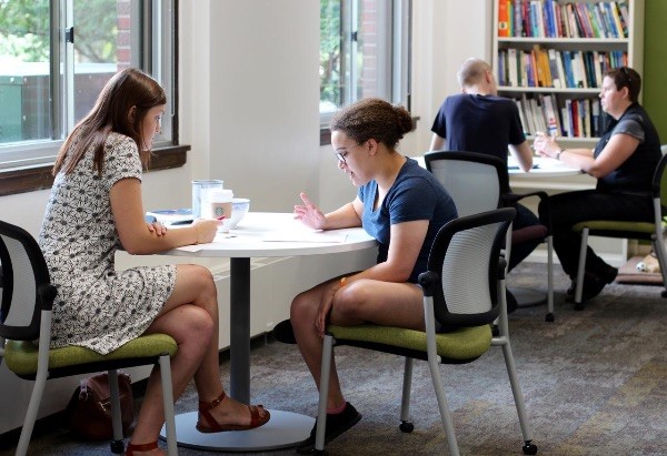 Two students studying at a table
