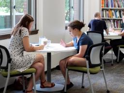 Two students studying at a table