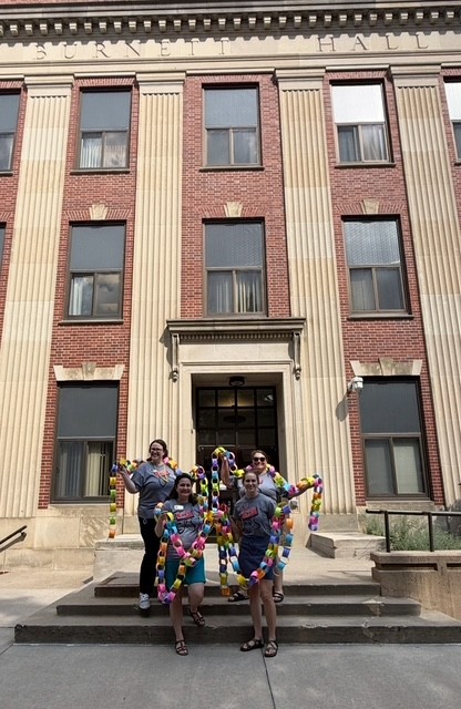 Advisors in front of Burnett Hall
