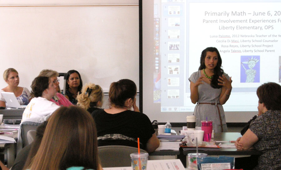 Luisa Palomo (standing) talks to Primarily Math Cohort 3 LPS on June 6.