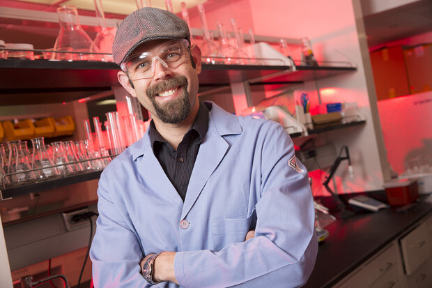 Photo of Dr. Stephen Morin in chemistry lab attire.