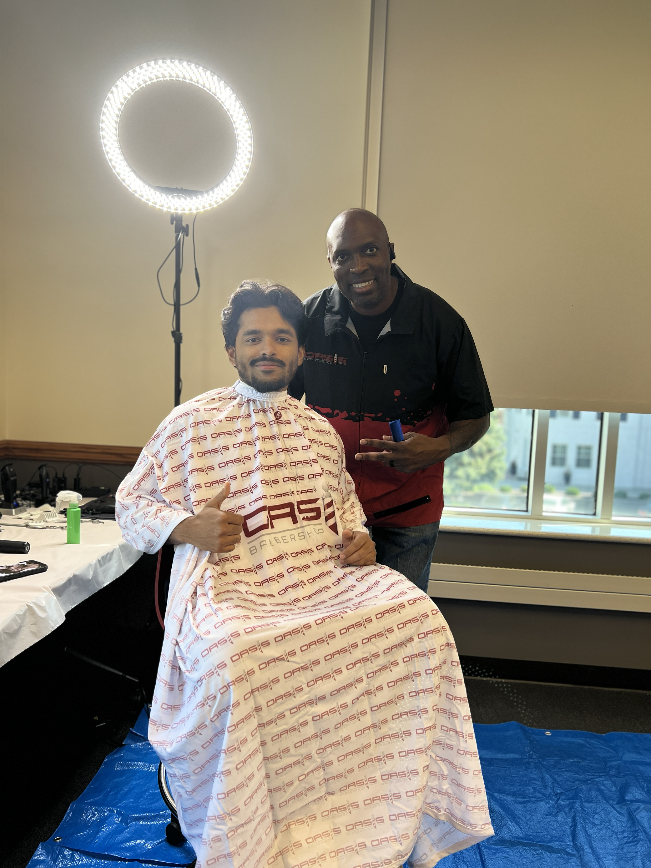 A photo of a student and a barber