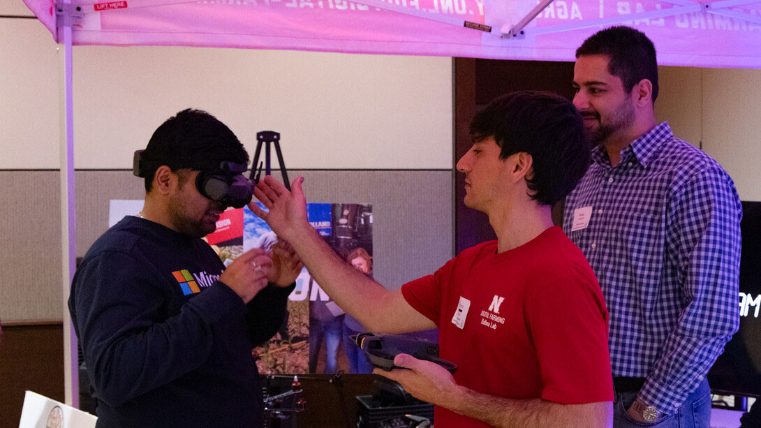 Students from the Digital Farming Lab and the Machine Automation & Agricultural Robotics (MAARS) Lab demonstrate nutrient management and robotics research during the Digital Ag Booth showcase during the inaugural session on Nov. 4.