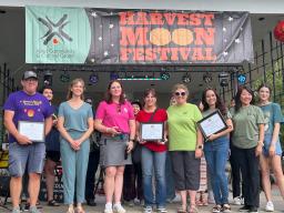 Pictured front L&ndash;R: Paul Vinton, Lincoln Mayor Leirion Gaylor Baird, ACCC staffer Lisa Guill, Extension Assistant Zahraa Rida, ACCC staffer Sheila Dorsey Vinton, ACCC staffer Thuy Ngoc Ho, ACCC staffer Rebecca Reinhardt and ACCC staffer Alina Pestushko.