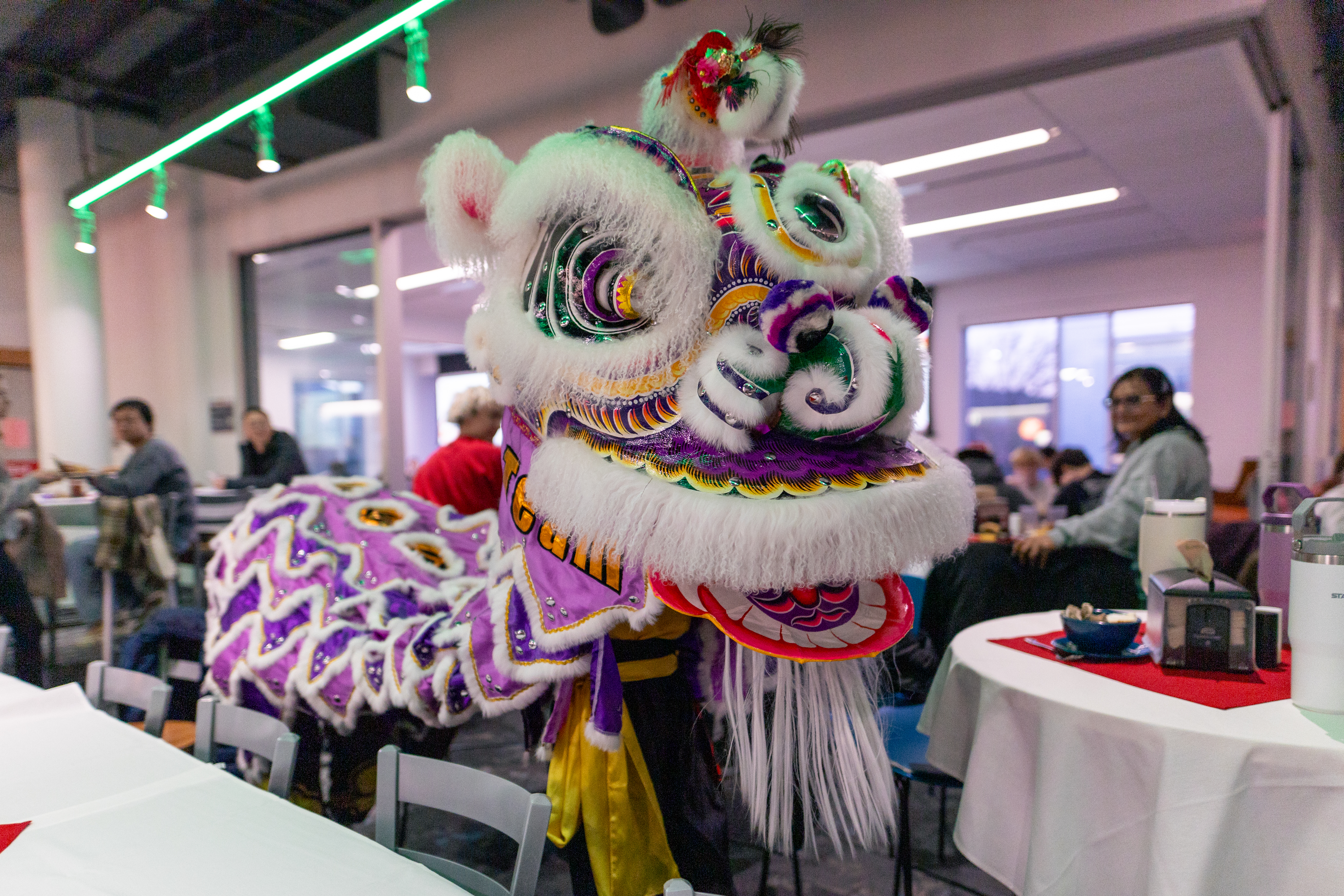 Lion Dancers move through the Dining Center