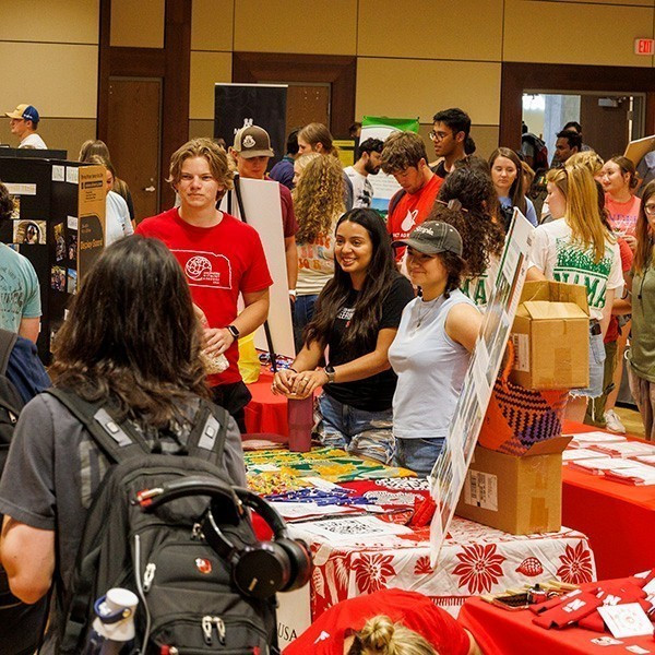 Students mingle with recognized student organization (RSO) members during an Nvolvement Fair. [Mike Jackson | Student Life Marketing and Communication]