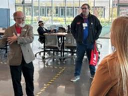 Dr. Mark Riley describes a new laser cutter for processing of thick metal sheets. The next day this equipment was lowered by crane into the basement of the Design Hub in the College of Engineering.