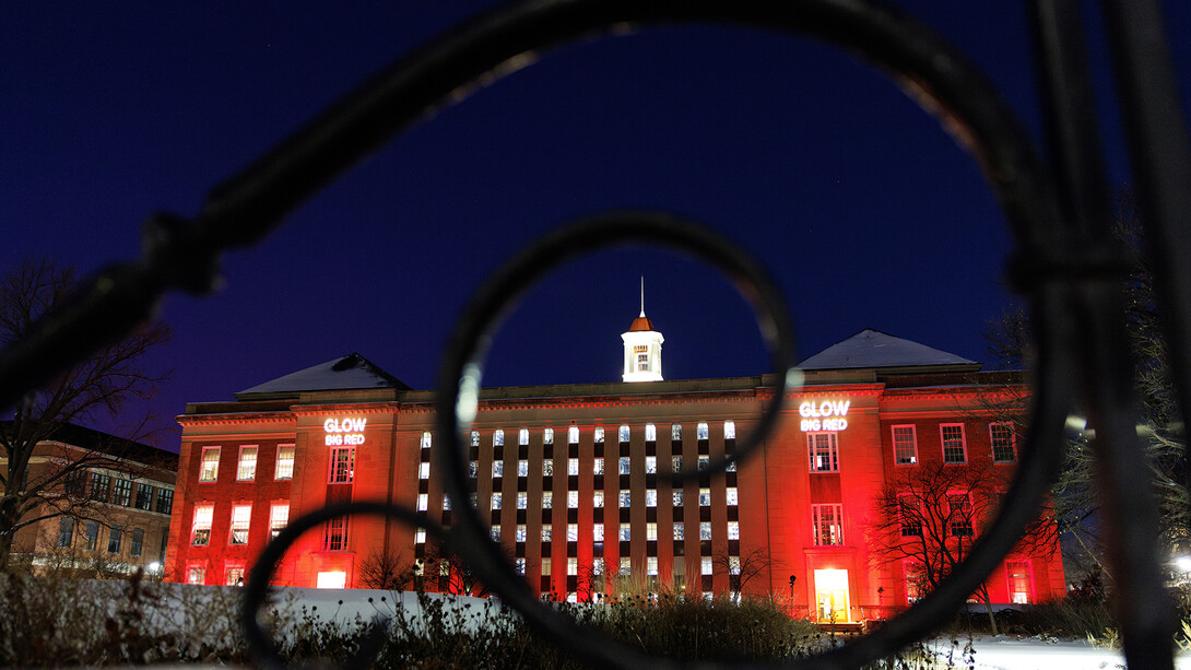 Love Library South is illuminated in red on Feb. 12, 2025, in honor of Glow Big Red &mdash; 24 Hours of Husker Giving.
