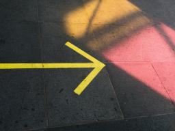 Yellow arrow pointing to the right at a patch of light