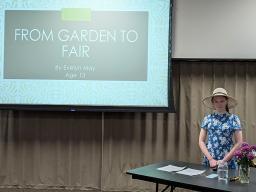 A 4-H youth and her presentation at the 2025 Illustrated Presentation & Video Communication Contest