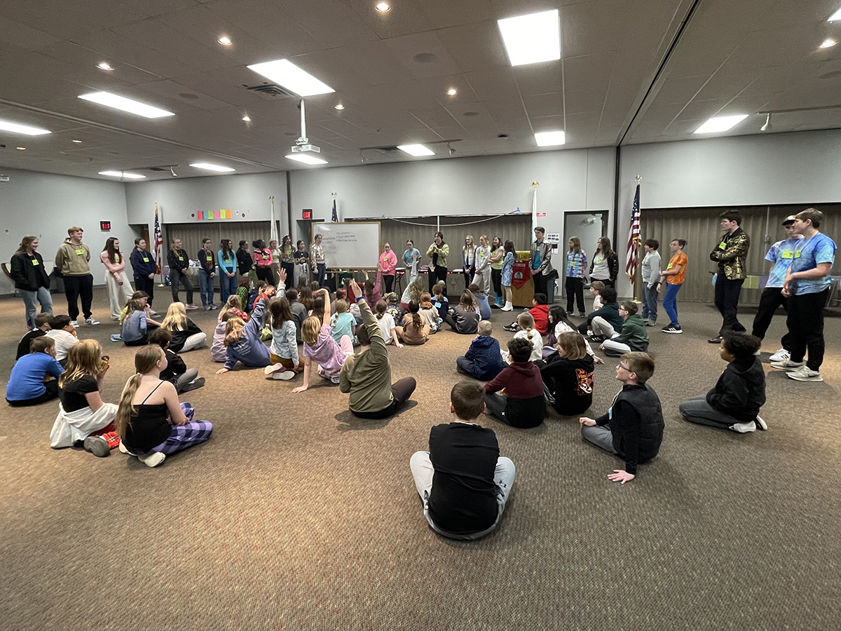 4-H Teen Council members introduce themselves to attendees at the overnight Lock-In for 4th and 5th graders.