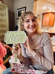 Kristin Plath with her Plant Lady sign