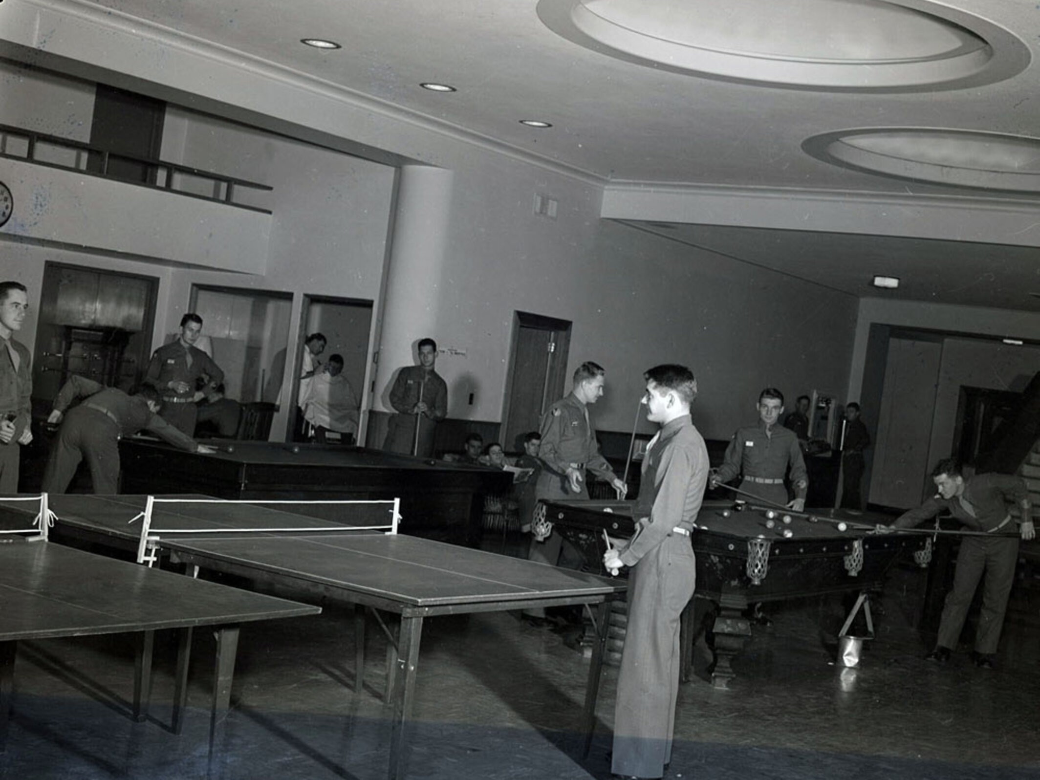 ASTP members playing pool and ping-pong in the areas that became the circulation desk for Love Library. (Archives & Special Collections)