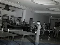 ASTP members playing pool and ping-pong in the areas that became the circulation desk for Love Library. (Archives & Special Collections)