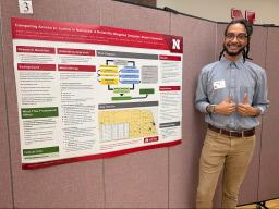 Armon'e Dean poses with his poster at the Student Research Days Undergraduate Poster Session and Creative Exhibition.