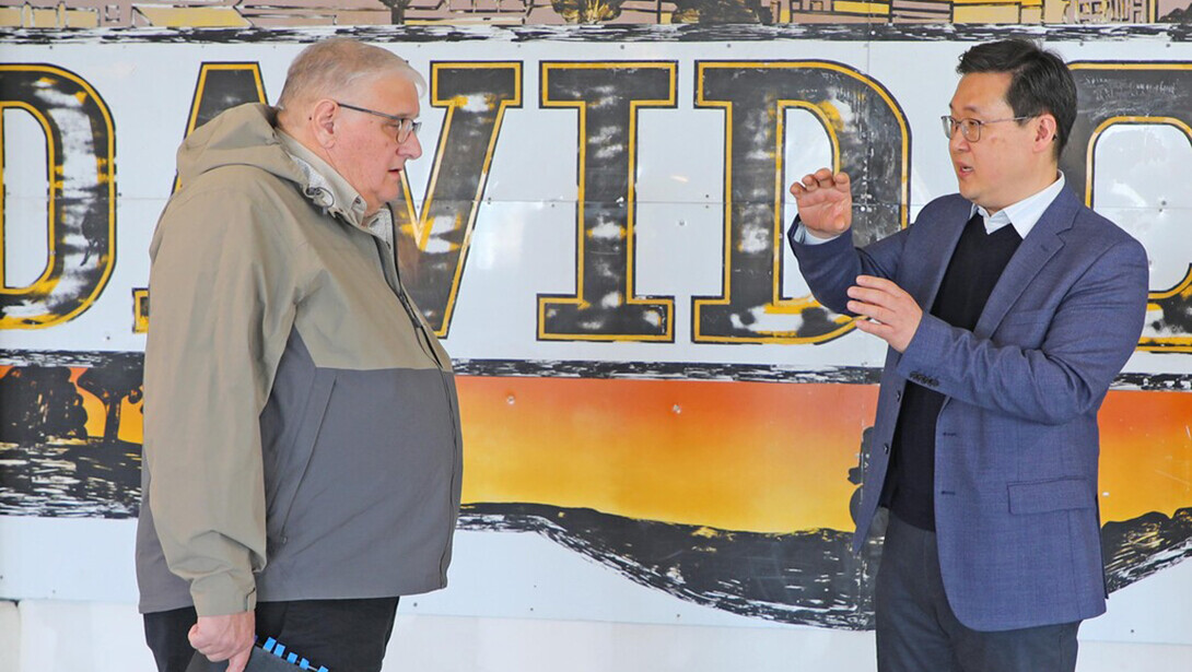 Keith Marvin (left), planning consultant and David City council member, gives community and regional planning faculty a tour of the city's progress.