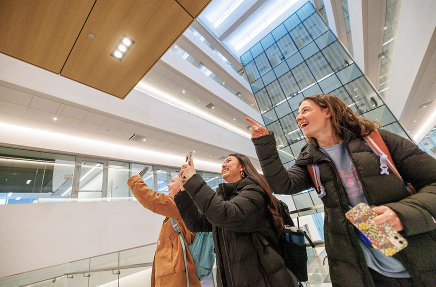 Students point at scenery in Kiewit Hall at the University of Nebraska-Lincoln (image credit: University Communication & Marketing).