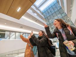 Students point at scenery in Kiewit Hall at UNL