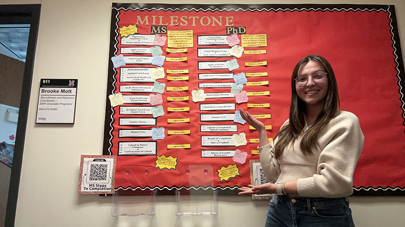 Brooke Mott, recruitment and retention coordinator, displays the resource board she created for doctoral and master&rsquo;s students at her office, 911 South Hardin Hall.  