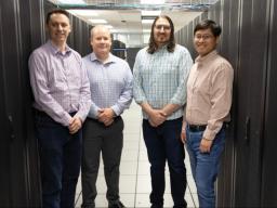 From left: Derek Weitzel, Garhan Attebury, Adam Caprez and Hongfeng Yu in the Holland Computing Center&rsquo;s Lincoln site, located at the Schorr Center. Credit: Cheyenne Rowe / Office of Research and Innovation