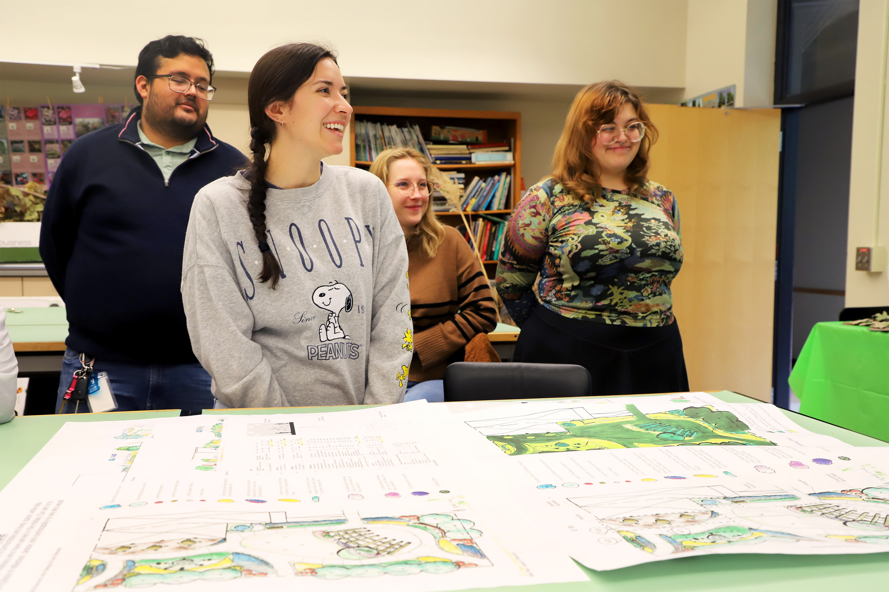 Senior Haley Klement, a plant and landscape systems major, speaks with residents from David City, Nebraska, during Ecological Landscape Design class taught by Kim Todd, professor of agronomy and horticulture. 