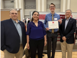 Top photo:  Octavious Gonzalez by his poster; Bottom photo: Roman Estrada, Mona Bavarian, Jarod Harris, Alan Dostal & Jerry Hudgins; Third photo:  The award Octavious won during his poster competition.