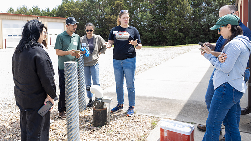 Sara Brock-Contreras (at center) walks visiting scholars from Kazakhstan through lesson plans created with funding of an EPA Environmental Education grant. 
