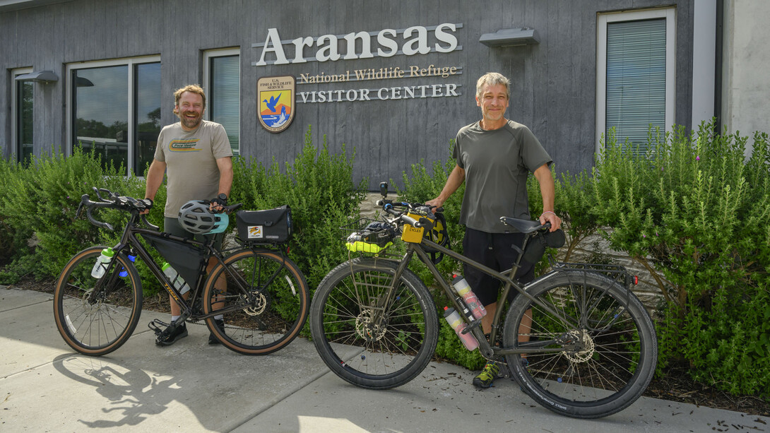 Andy Caven (left) and Michael Forsberg pose with their bicycles at the Aransas National Wildlife Refuge Visitors Center in Austwell, Texas.  Courtesy | Mariah Lundgren