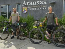 Andy Caven (left) and Michael Forsberg pose with their bicycles at the Aransas National Wildlife Refuge Visitors Center in Austwell, Texas.  Courtesy | Mariah Lundgren