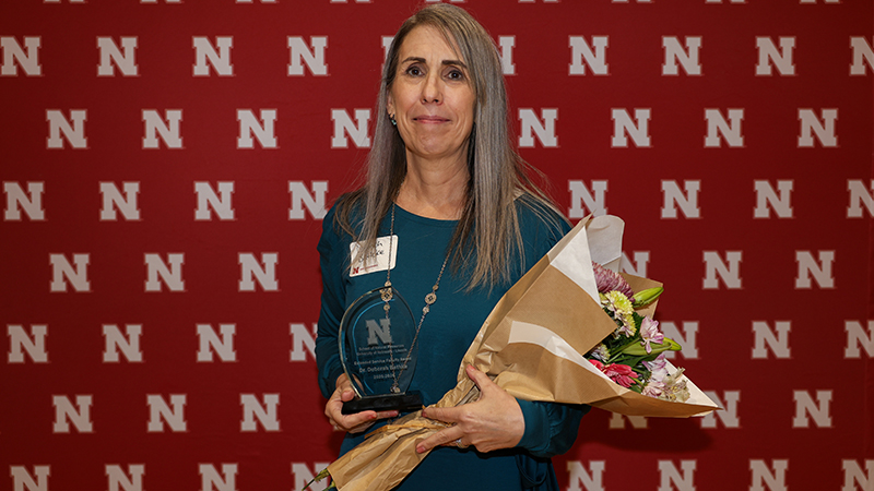 Deborah Bathke, state climatologist, accepts the Extended Service Faculty Award at the spring banquet of the School of Natural Resources on April 11, 2026. Photo by Marissa Lindemann