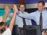 A 2012 Weather Camp participants gets a few high-fives from the KOLN news team during a visit there in June.