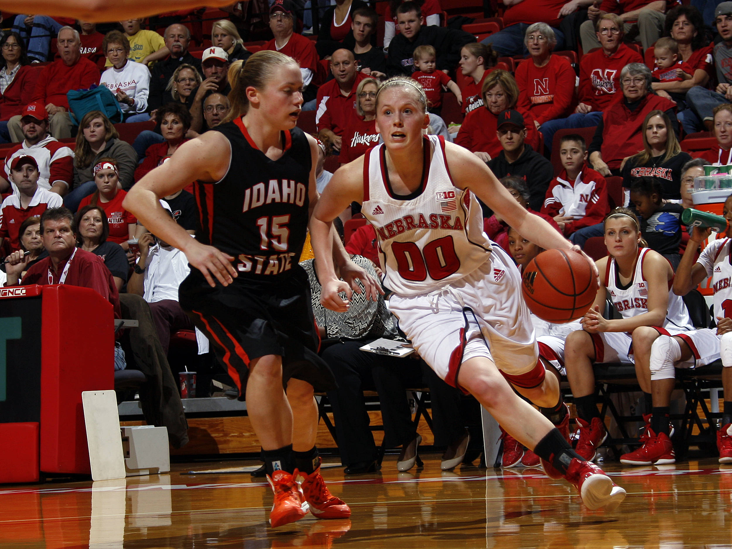 Senior Lindsey Moore drives the lane against an Idaho State defender.